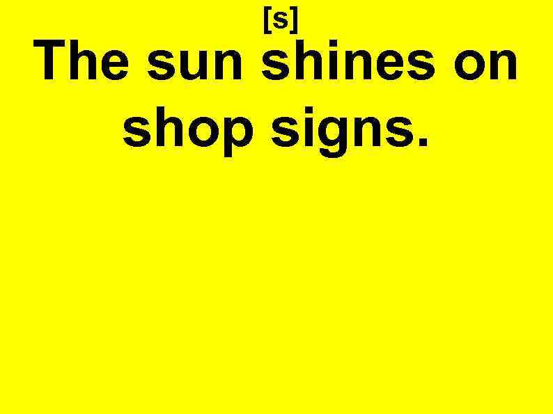 [s] The sun shines on shop signs. 