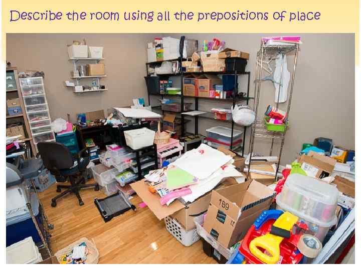 Describe the room using all the prepositions of place 