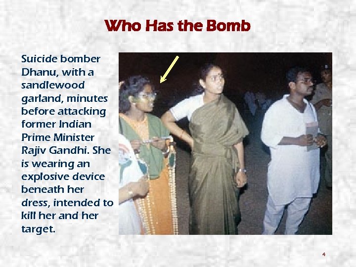 Who Has the Bomb Suicide bomber Dhanu, with a sandlewood garland, minutes before attacking