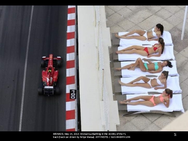 MONACO, May 25, 2013: Woman sunbathing in the vicinity of the F 1 track
