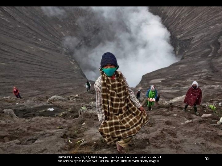INDONESIA, Java, July 24, 2013: People collecting victims thrown into the crater of the