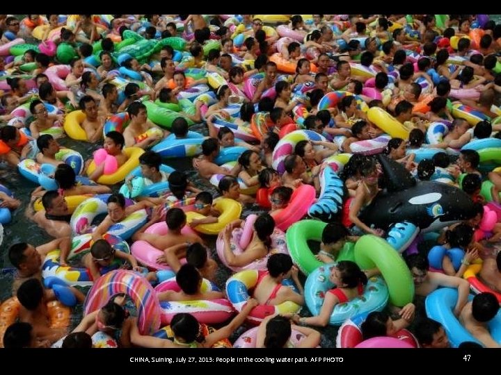 CHINA, Suining, July 27, 2013: People in the cooling water park. AFP PHOTO 47