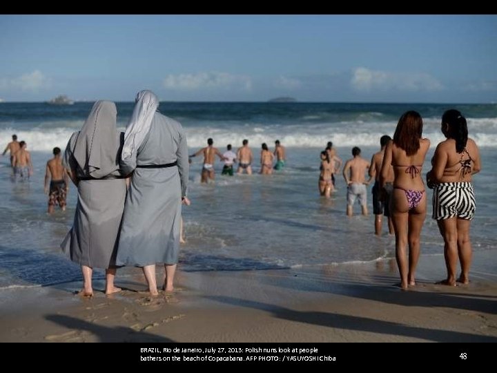 BRAZIL, Rio de Janeiro, July 27, 2013: Polish nuns look at people bathers on