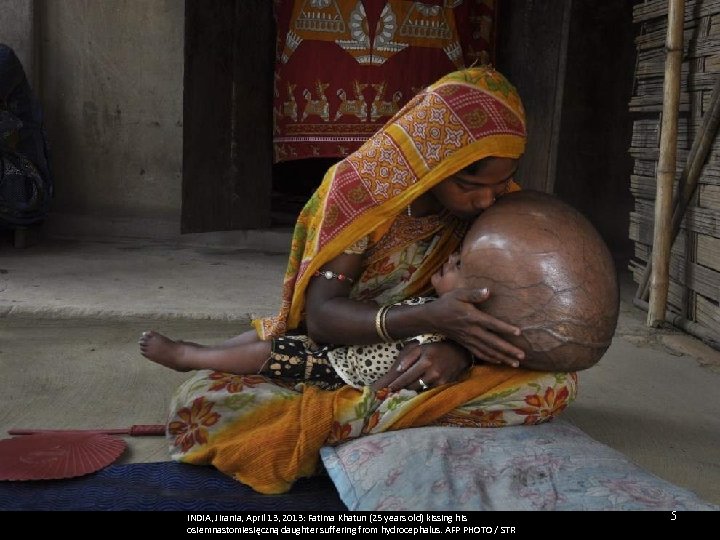 INDIA, Jirania, April 13, 2013: Fatima Khatun (25 years old) kissing his osiemnastomiesięczną daughter