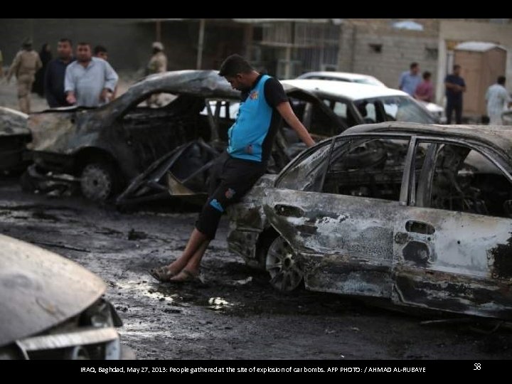 IRAQ, Baghdad, May 27, 2013: People gathered at the site of explosion of car
