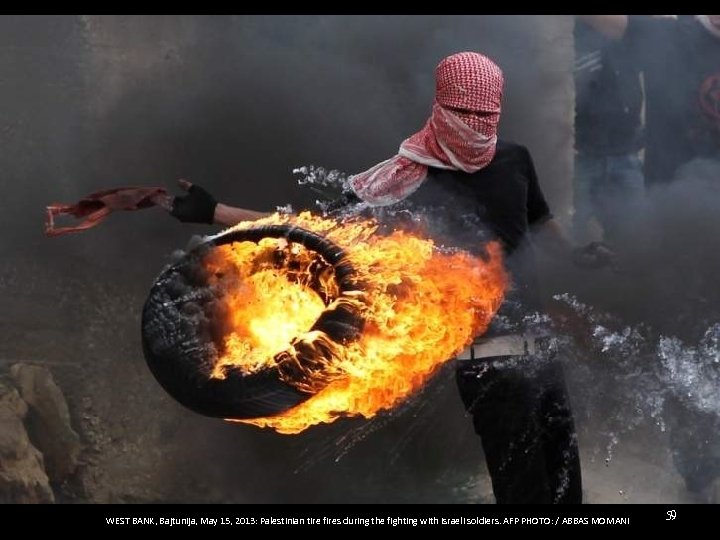 WEST BANK, Bajtunija, May 15, 2013: Palestinian tire fires during the fighting with Israeli