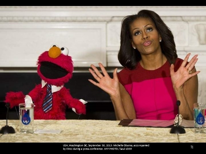 USA, Washington DC, September 30, 2013: Michelle Obama, accompanied by Elmo during a press