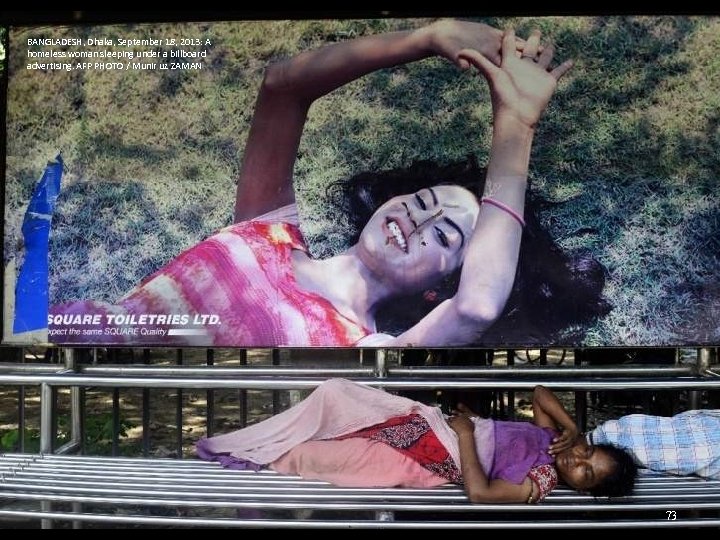 BANGLADESH, Dhaka, September 18, 2013: A homeless woman sleeping under a billboard advertising. AFP