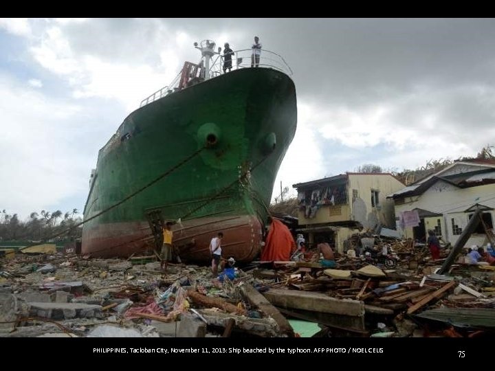 PHILIPPINES, Tacloban City, November 11, 2013: Ship beached by the typhoon. AFP PHOTO /