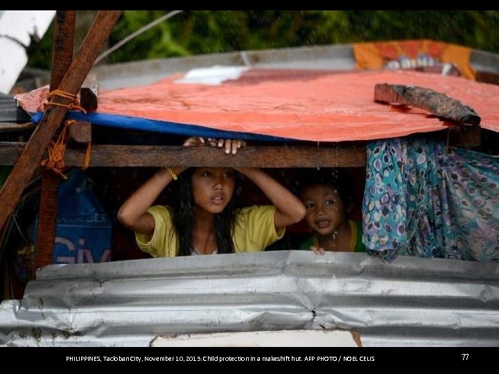 PHILIPPINES, Tacloban City, November 10, 2013: Child protection in a makeshift hut. AFP PHOTO