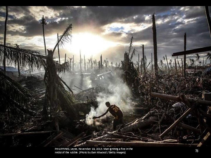 PHILIPPINES, Leyte, November 19, 2013: Man igniting a fire in the midst of the