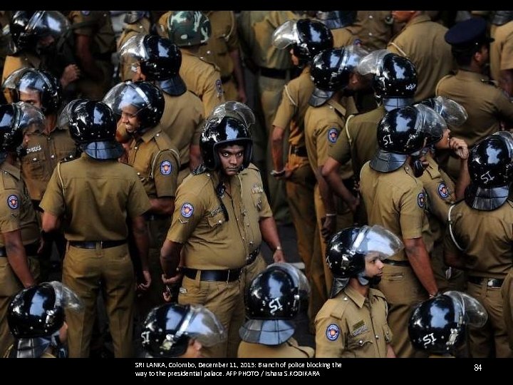 SRI LANKA, Colombo, December 11, 2013: Branch of police blocking the way to the