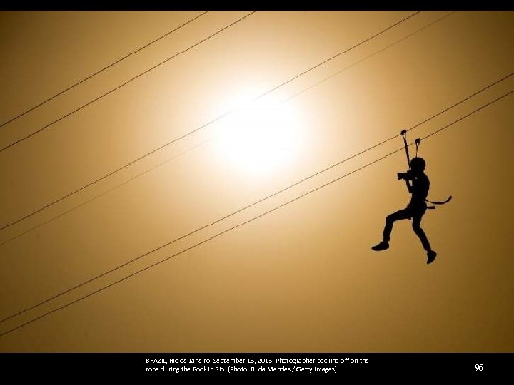 BRAZIL, Rio de Janeiro, September 13, 2013: Photographer backing off on the rope during