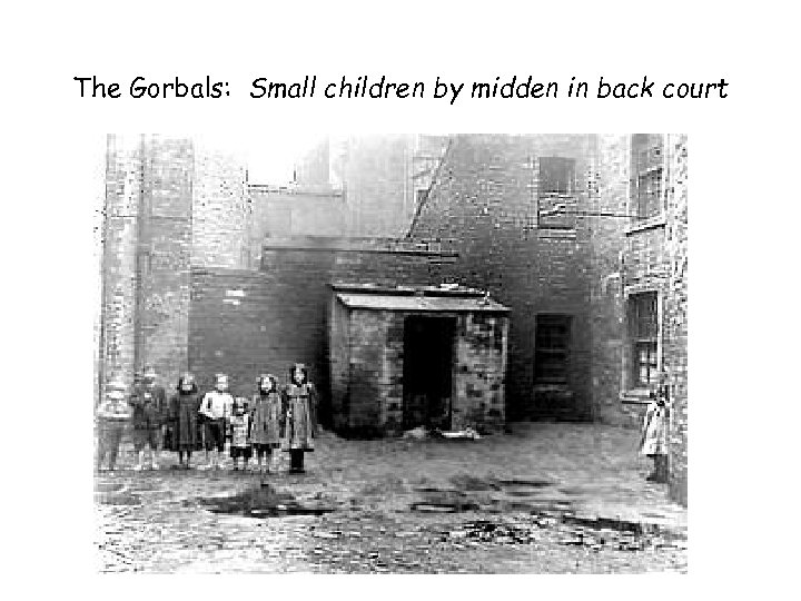 The Gorbals: Small children by midden in back court 