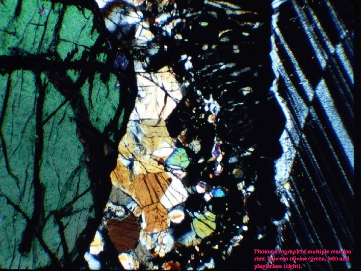 Photomicrograph of multiple reaction rims between olivine (green, left) and plagioclase (right). 