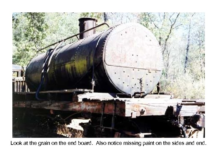 Look at the grain on the end board. Also notice missing paint on the