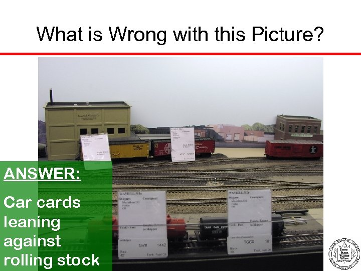 What is Wrong with this Picture? ANSWER: Car cards leaning against rolling stock 
