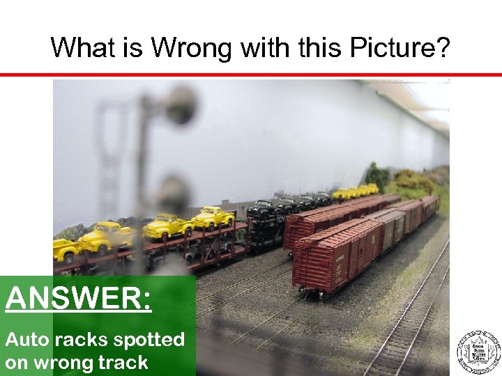 What is Wrong with this Picture? ANSWER: Auto racks spotted on wrong track 