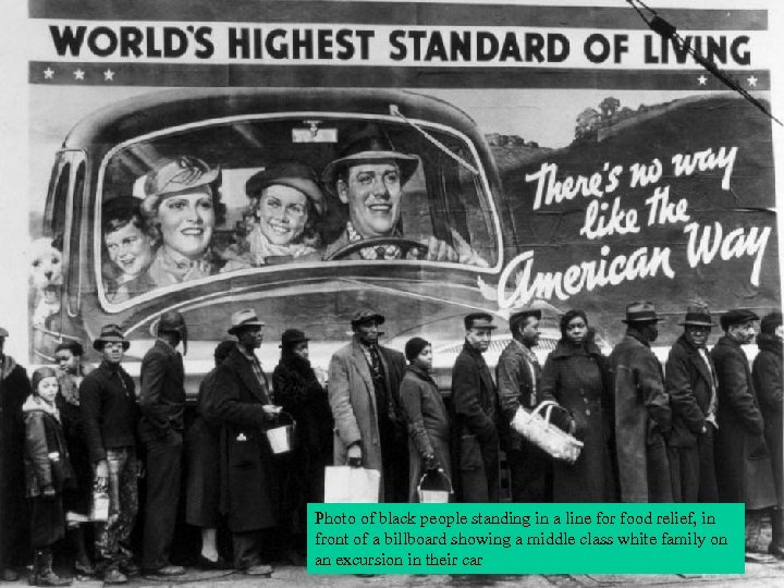 Photo of black people standing in a line for food relief, in front of