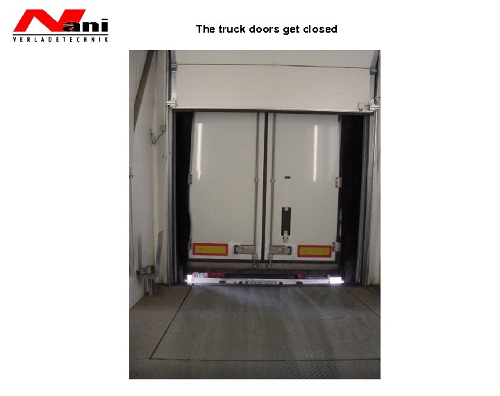 The truck doors get closed 