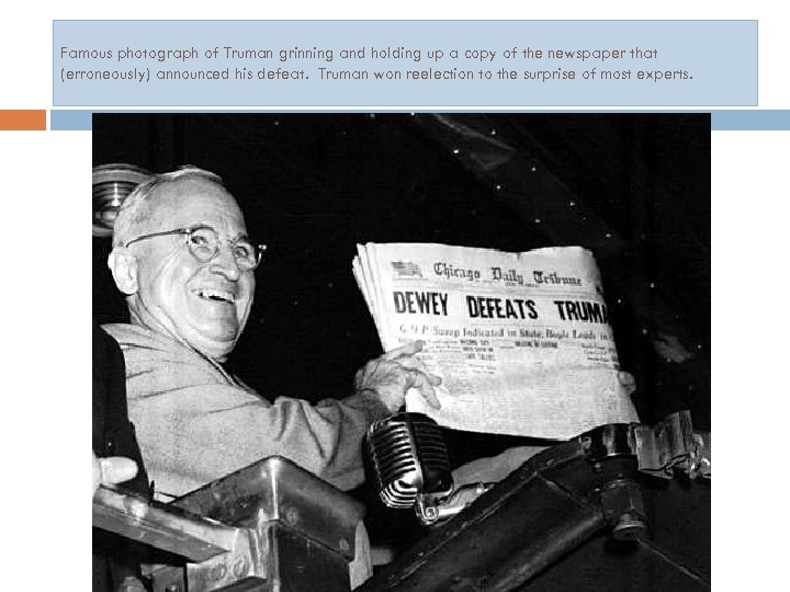 Famous photograph of Truman grinning and holding up a copy of the newspaper that