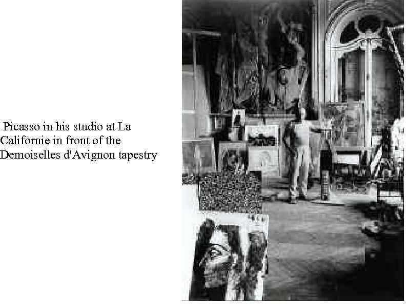  Picasso in his studio at La Californie in front of the Demoiselles d'Avignon