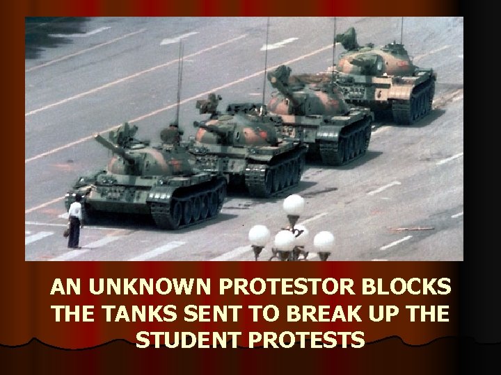 AN UNKNOWN PROTESTOR BLOCKS THE TANKS SENT TO BREAK UP THE STUDENT PROTESTS 