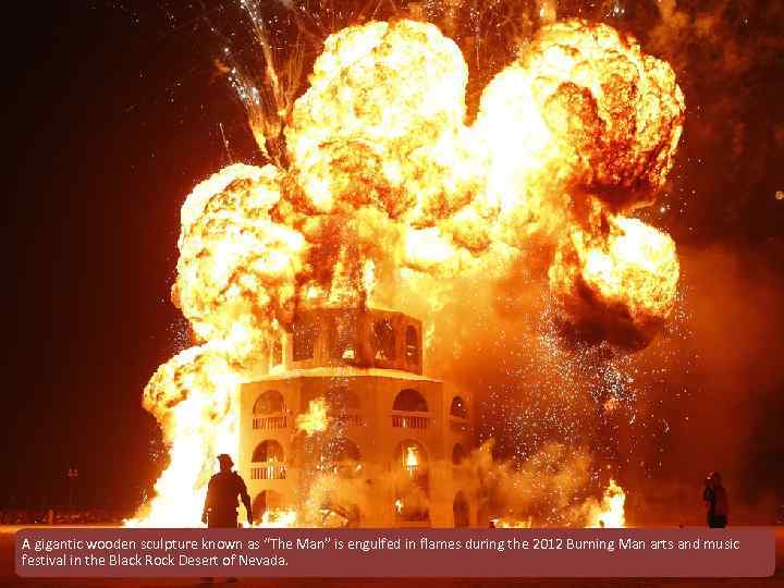 A gigantic wooden sculpture known as “The Man” is engulfed in flames during the