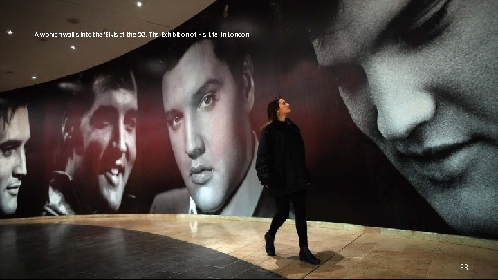 A woman walks into the 'Elvis at the O 2, The Exhibition of His