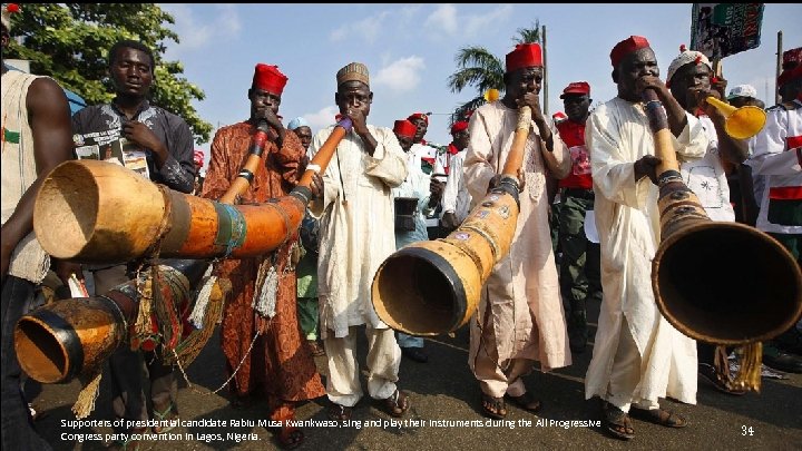 Supporters of presidential candidate Rabiu Musa Kwankwaso, sing and play their instruments during the