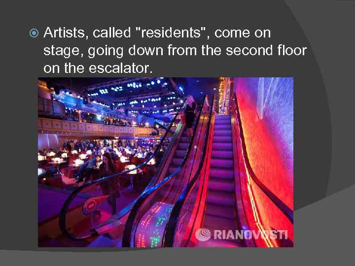  Artists, called "residents", come on stage, going down from the second floor on