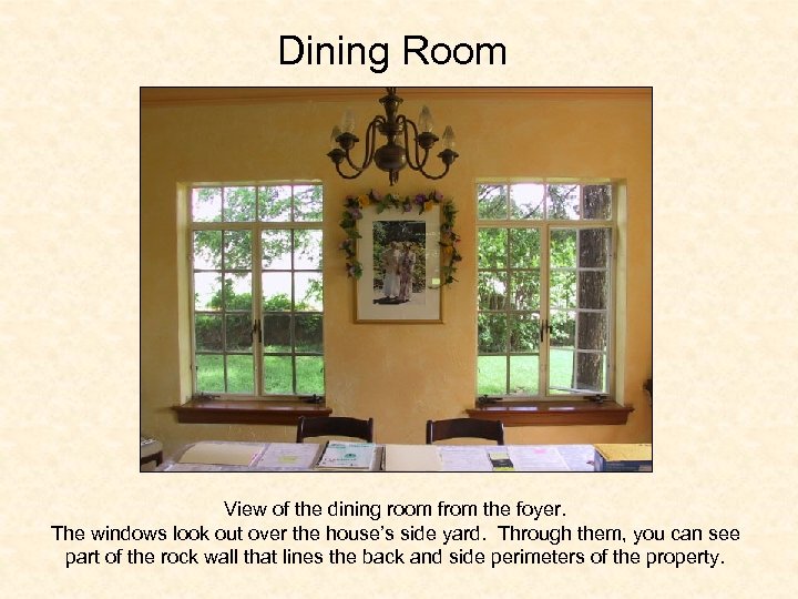 Dining Room View of the dining room from the foyer. The windows look out