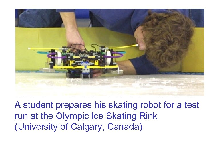 A student prepares his skating robot for a test run at the Olympic Ice