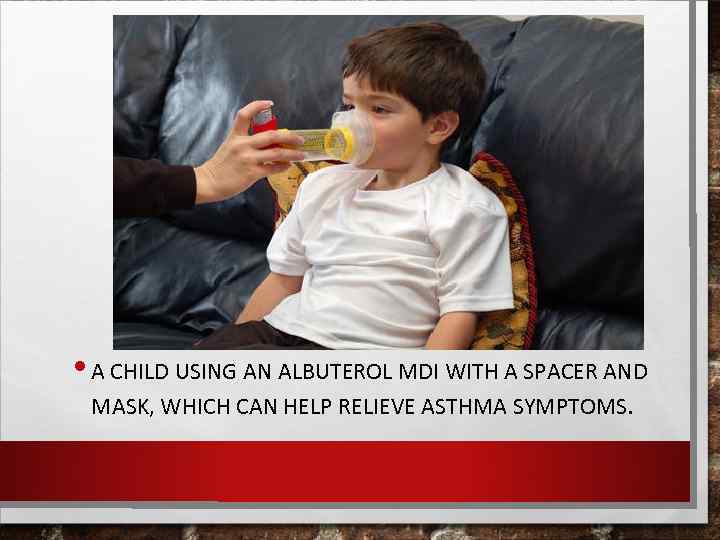  • A CHILD USING AN ALBUTEROL MDI WITH A SPACER AND MASK, WHICH