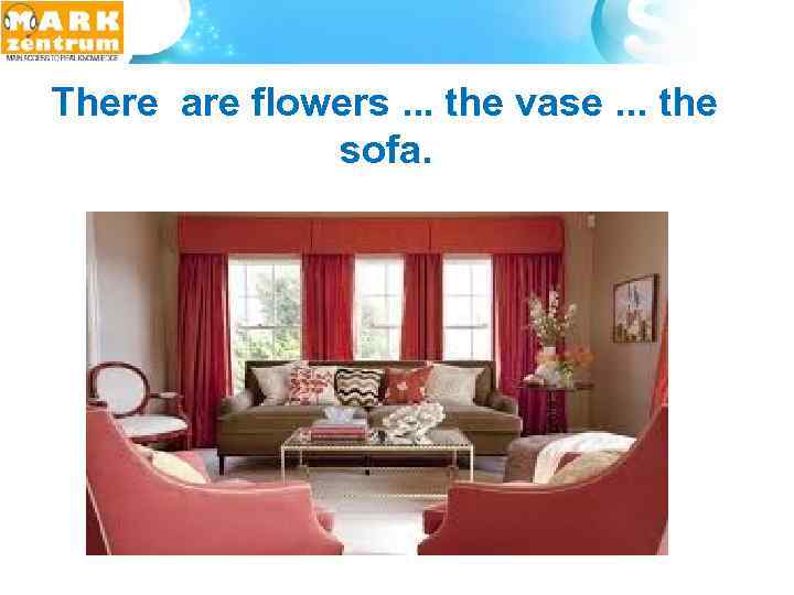 There are flowers. . . the vase. . . the sofa. 