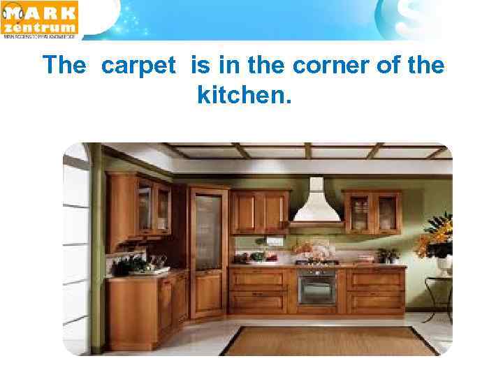  The carpet is in the corner of the kitchen. 