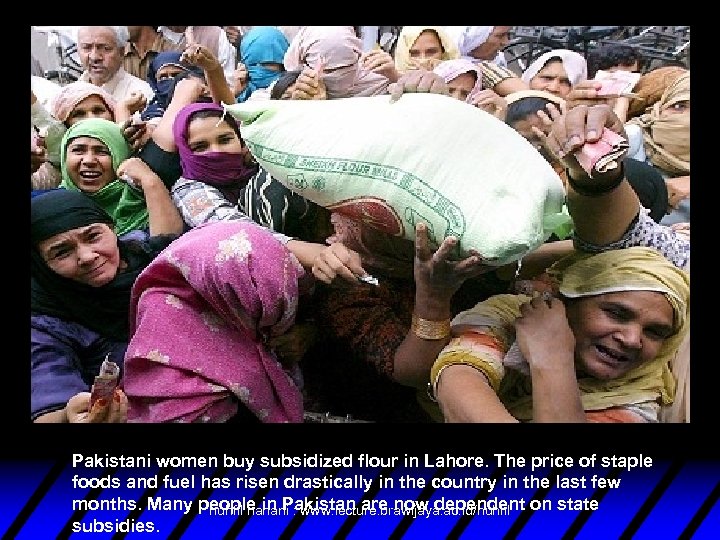 Pakistani women buy subsidized flour in Lahore. The price of staple foods and fuel