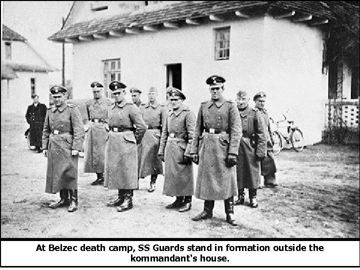 At Belzec death camp, SS Guards stand in formation outside the kommandant's house. 