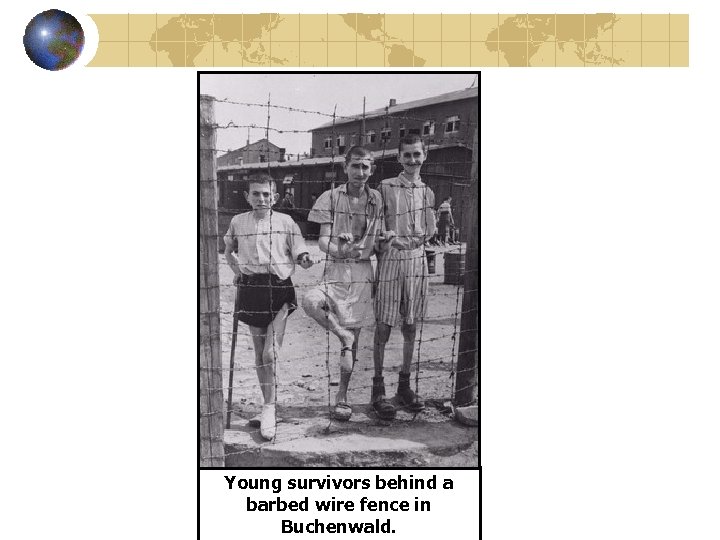 Young survivors behind a barbed wire fence in Buchenwald. 