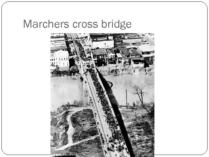 Marchers cross bridge 