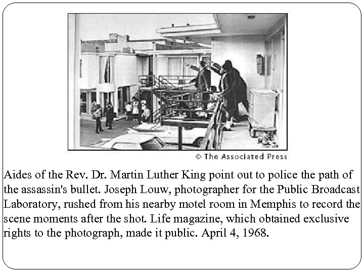 Aides of the Rev. Dr. Martin Luther King point out to police the path