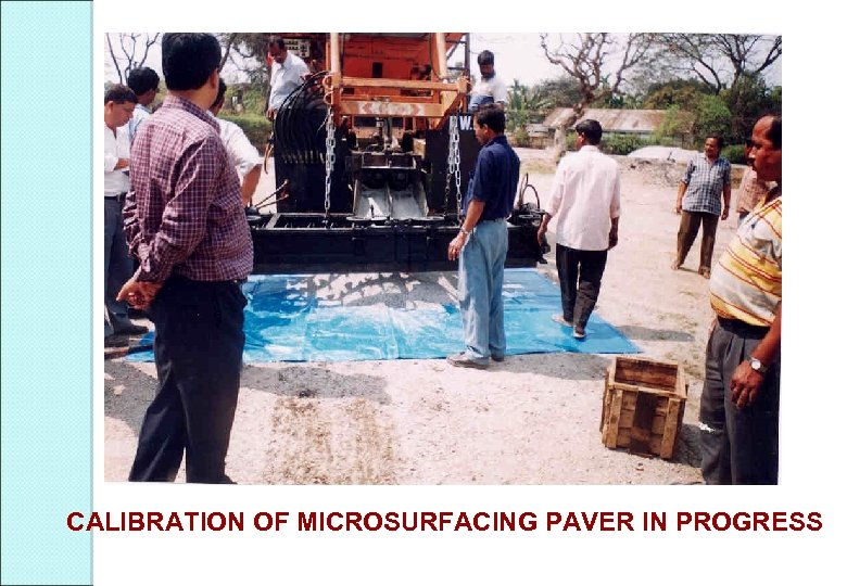 CALIBRATION OF MICROSURFACING PAVER IN PROGRESS 