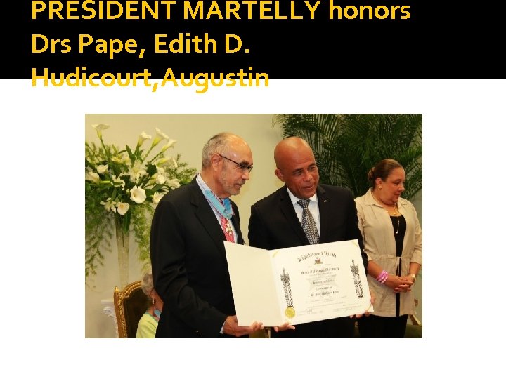 PRESIDENT MARTELLY honors Drs Pape, Edith D. Hudicourt, Augustin 