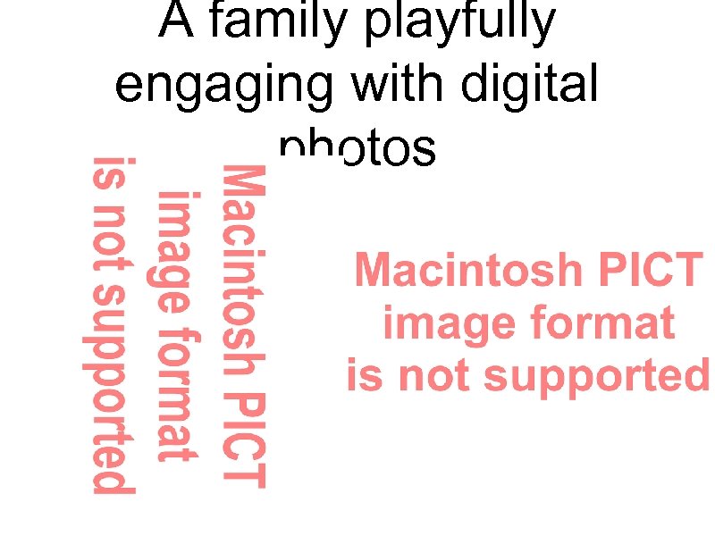 A family playfully engaging with digital photos 