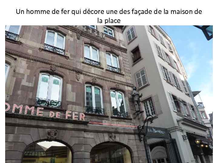 Un homme de fer qui décore une des façade de la maison de la