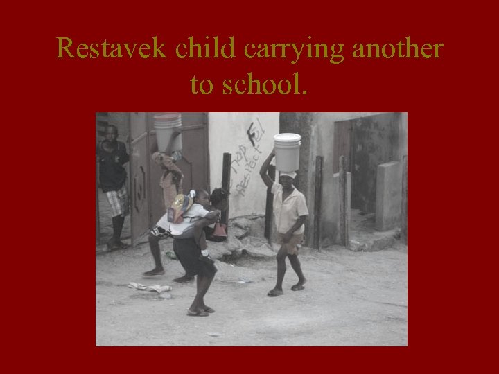 Restavek child carrying another to school. 