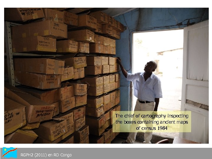 The chief of cartography inspecting the boxes containing ancient maps of census 1984 RGPH