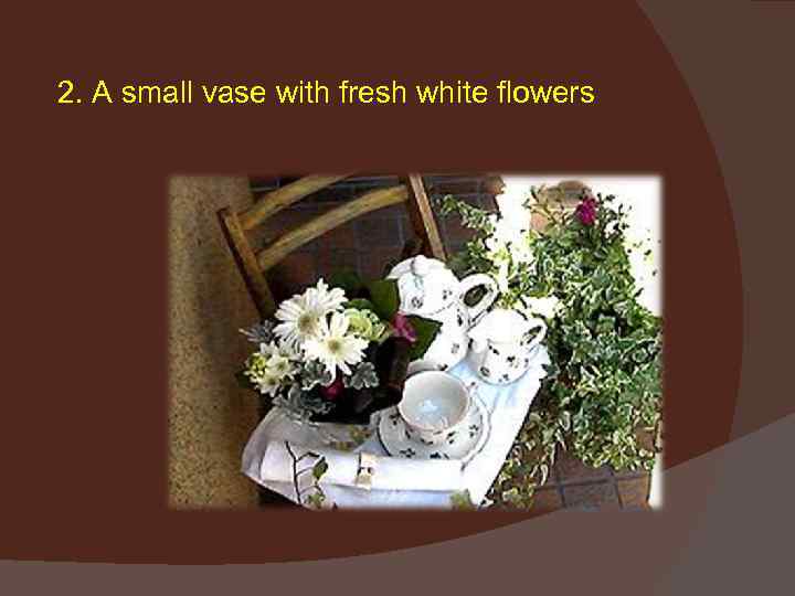 2. A small vase with fresh white flowers 