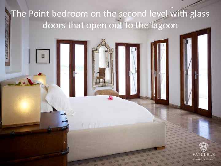 The Point bedroom on the second level with glass doors that open out to