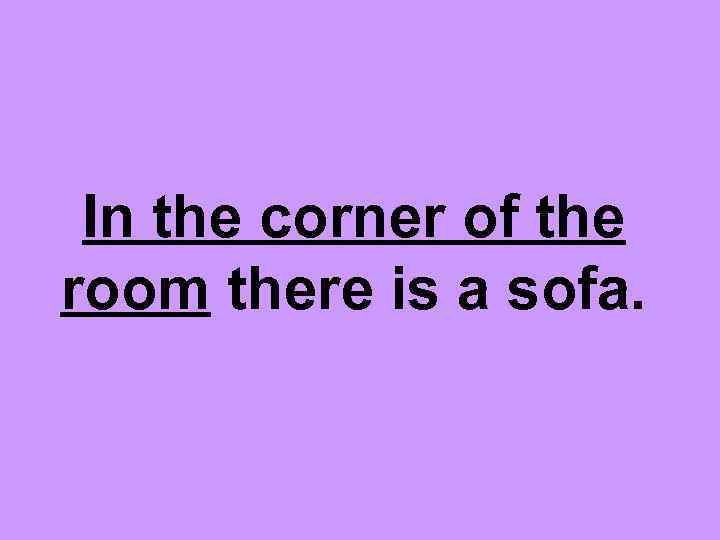 In the corner of the room there is a sofa. 